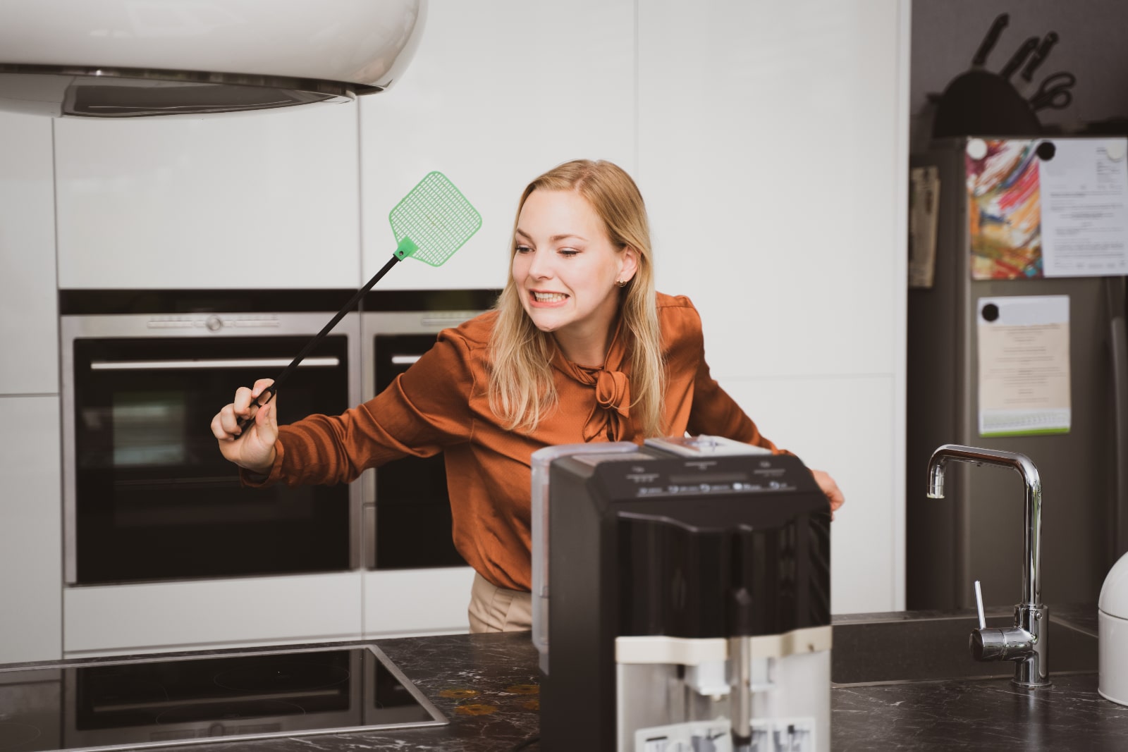 Woman doing DIY pest control at home